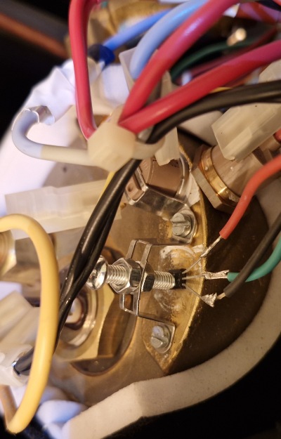 A close up view of the newly installed temperature sensor where a thermostat used to be